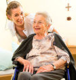 smiling female caregiver and patient